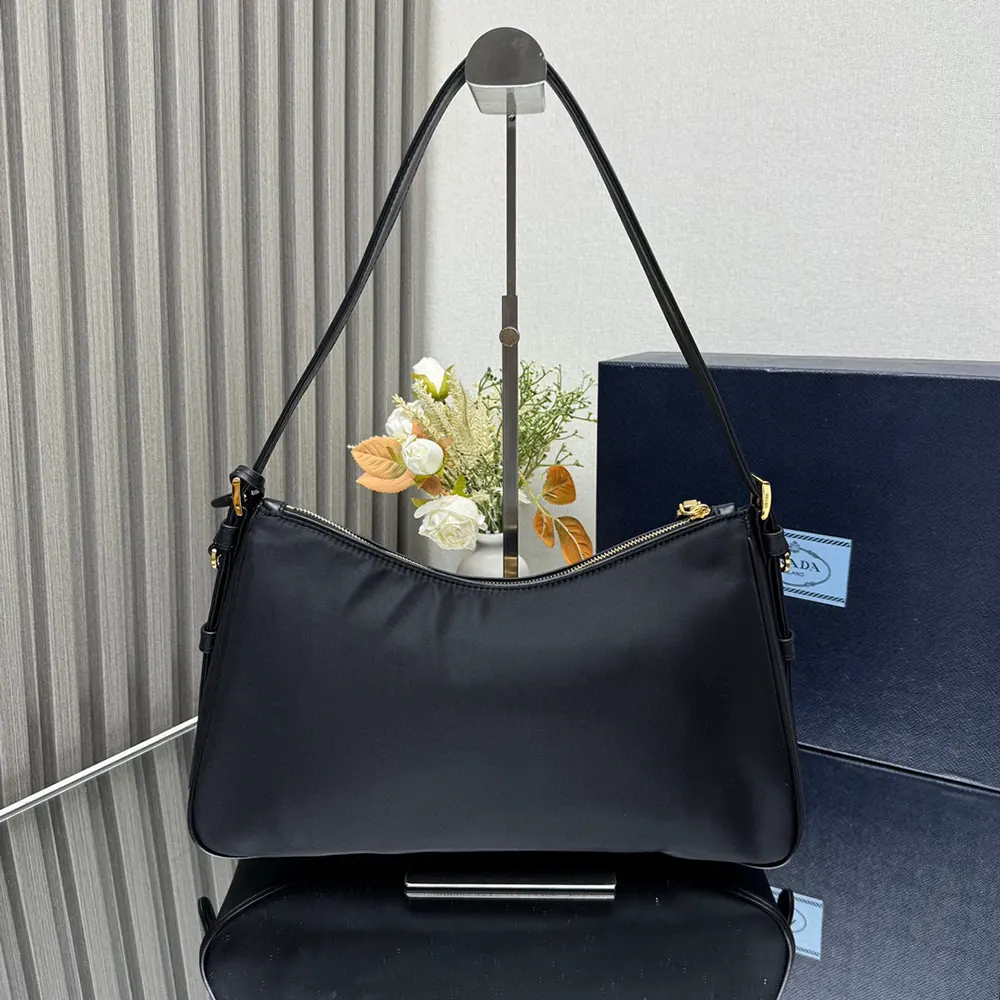 Side angle showing adjustable strap on Prada Women Aimée shoulder bag