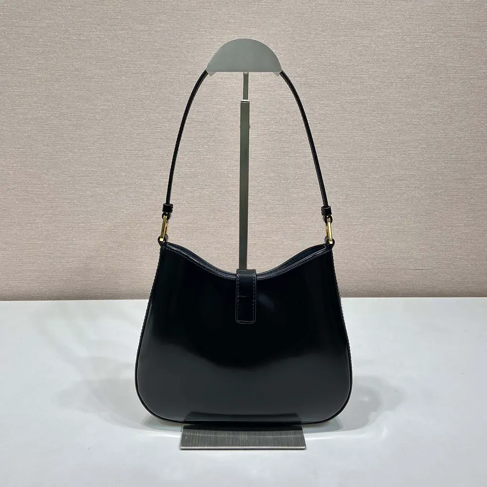 Side profile showcasing sleek silhouette of Prada Women Cleo Brushed Leather Shoulder Bag