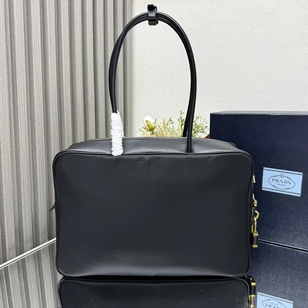 Side profile showing silhouette of Prada Women Large Re-Nylon and Leather Top-handle Bag