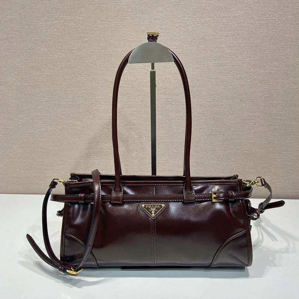 Close-up of silver-tone hardware on Prada Women Medium Leather Handbag