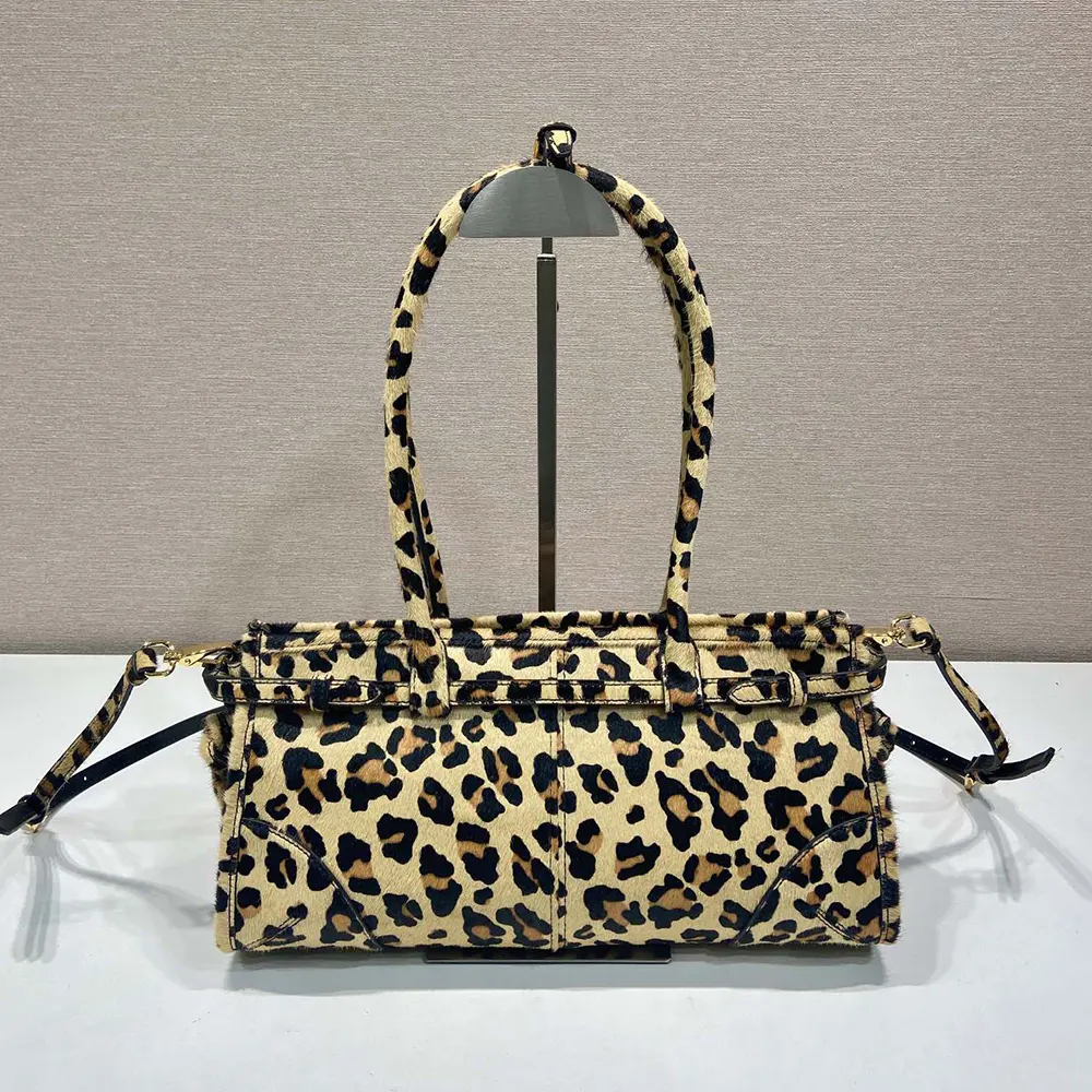 Side angle showing silhouette and flap closure of Prada Women Medium Printed Leather Handbag