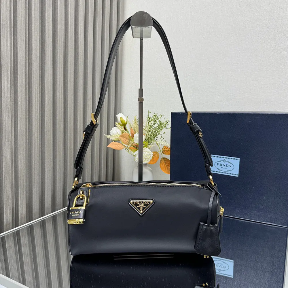 Close-up of signature padlock hardware on Prada Women Medium Shoulder Bag