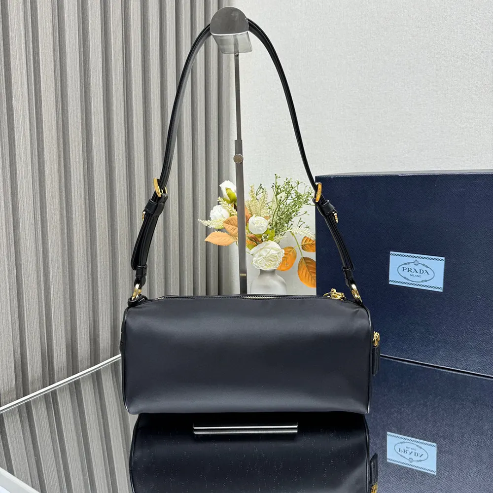 Side profile showing adjustable strap of Prada Women Medium Re-Nylon Shoulder Bag