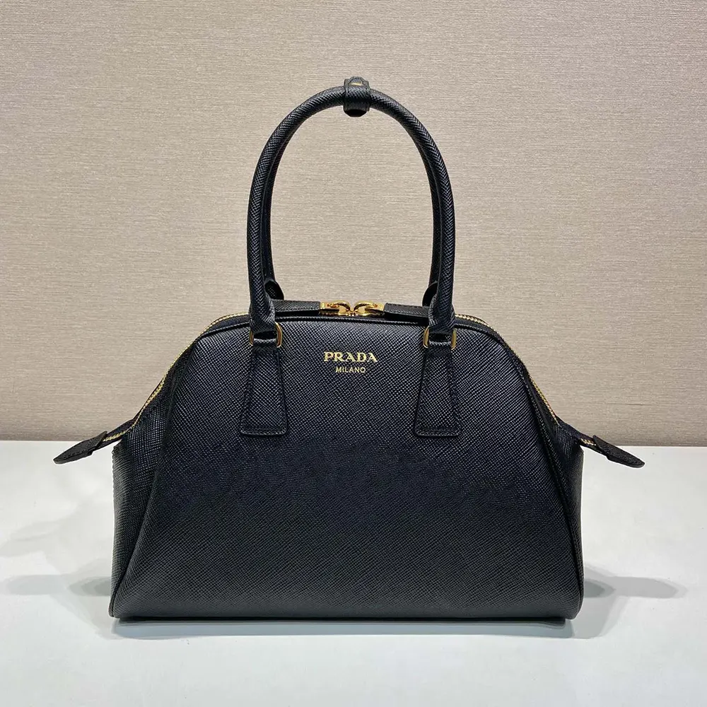 Close-up of textured Saffiano leather and silver hardware on Prada bag