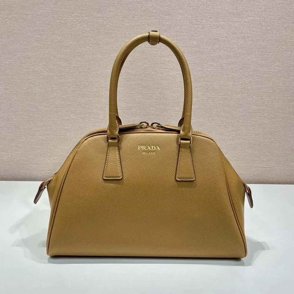 Close-up of textured Saffiano leather on Prada Women Medium Bag in brown