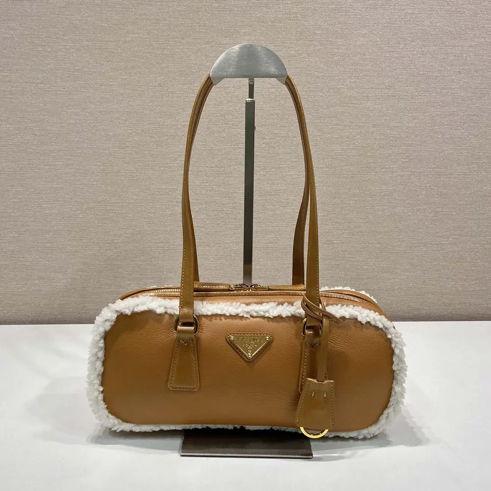 Side profile showing structured silhouette of Prada Women Medium Shearling Bag