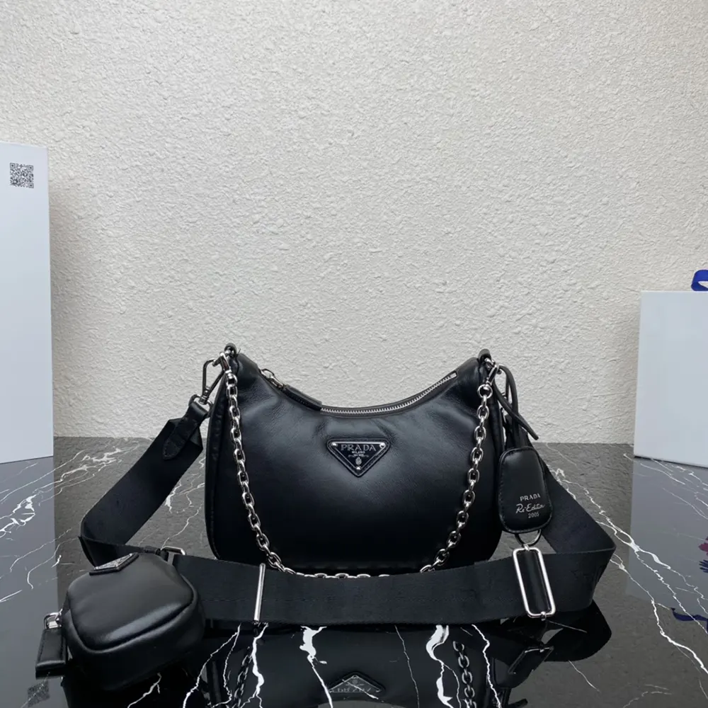 Close-up of padded nappa leather texture and Prada triangular logo plaque