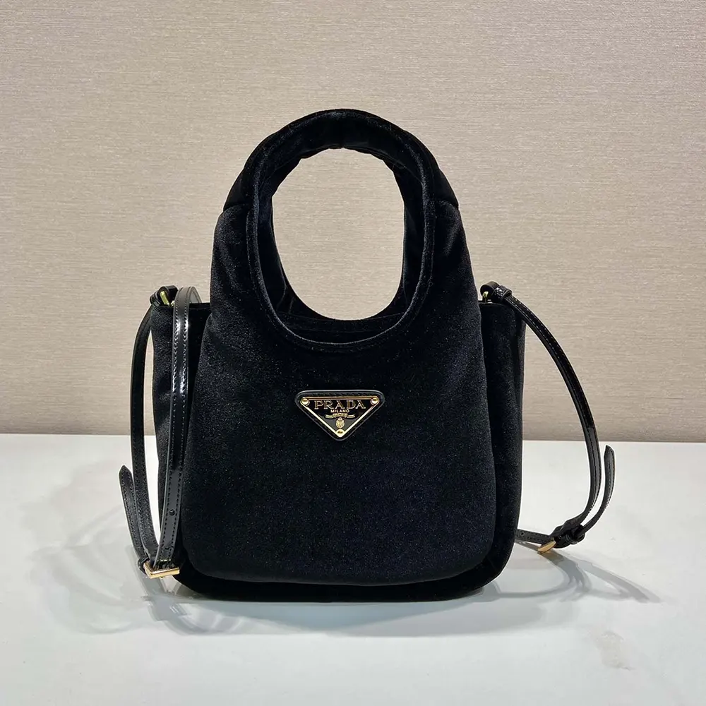 Close-up of gold-tone hardware on Prada Women Padded Velvet Mini Handbag