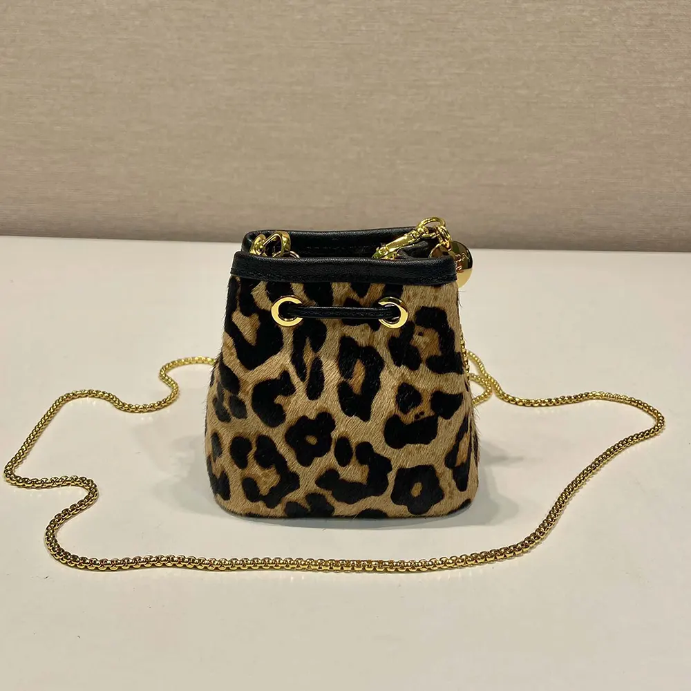Side angle showing compact shape of Prada Women Printed Leather Mini Pouch