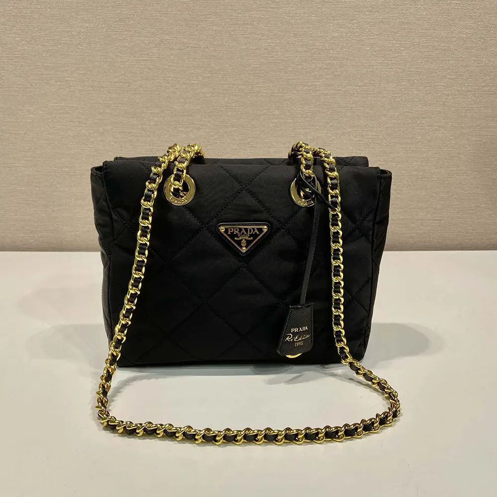 Side angle showing silhouette and texture of Prada Women Re-Edition 1995 Chaîne Re-Nylon Tote Bag-Black