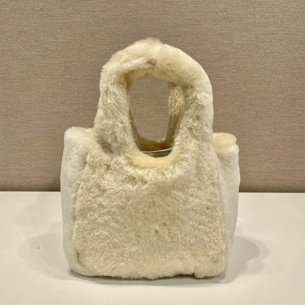 Side angle showing shearling texture on Prada Women Shearling Mini Handbag-Beige