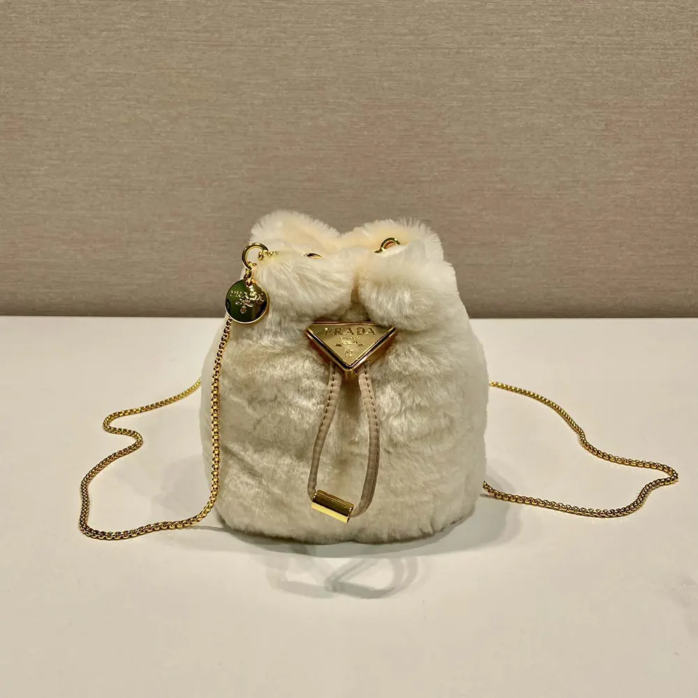 Close-up of beige sheepskin texture on Prada Women Mini Pouch