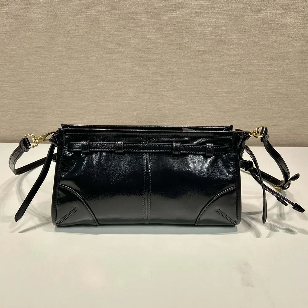 Side profile highlighting the structured silhouette of Prada Women Small Leather Shoulder Bag-Black