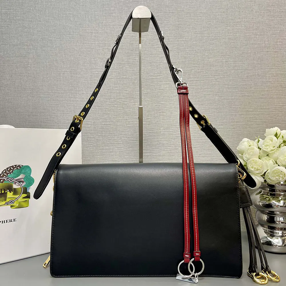 Side angle showing soft leather texture of Prada Women Soft Sound Large Leather Shoulder Bag