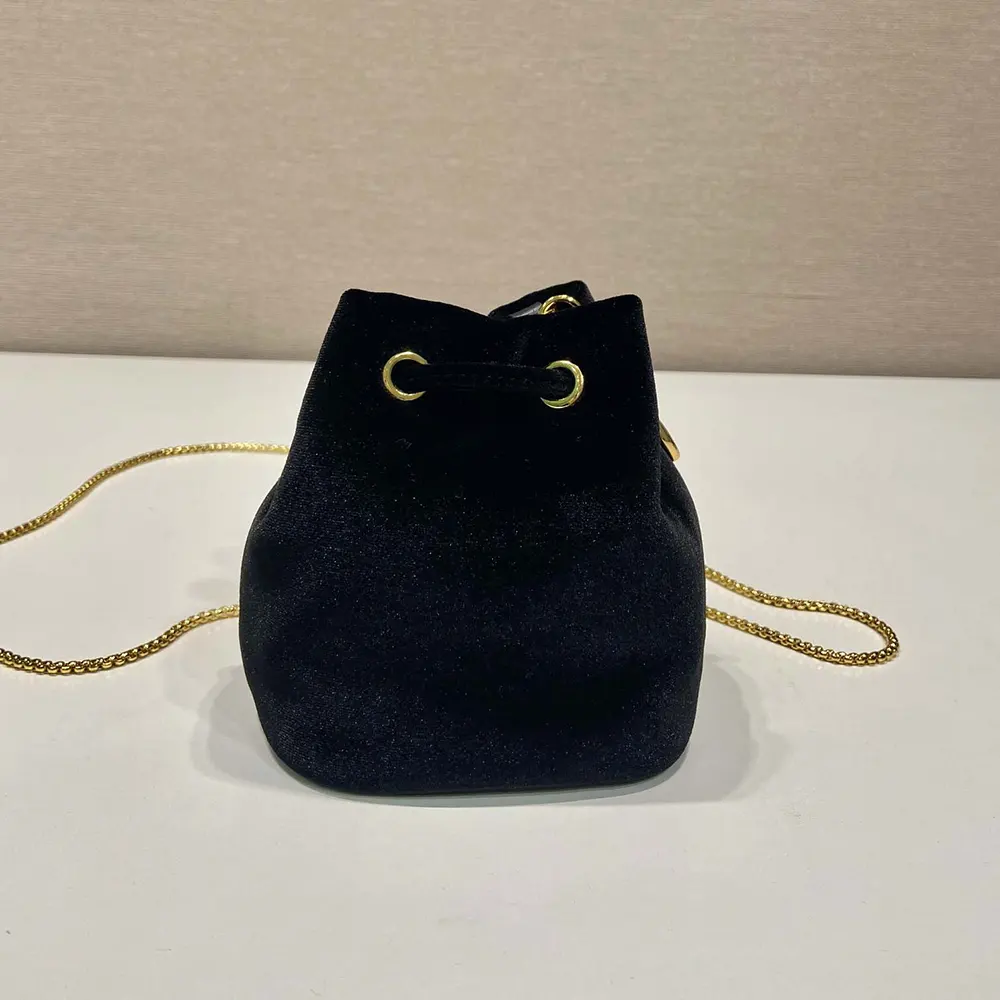 Side profile showing slim shoulder strap of Prada Women Velvet Mini Pouch-Black