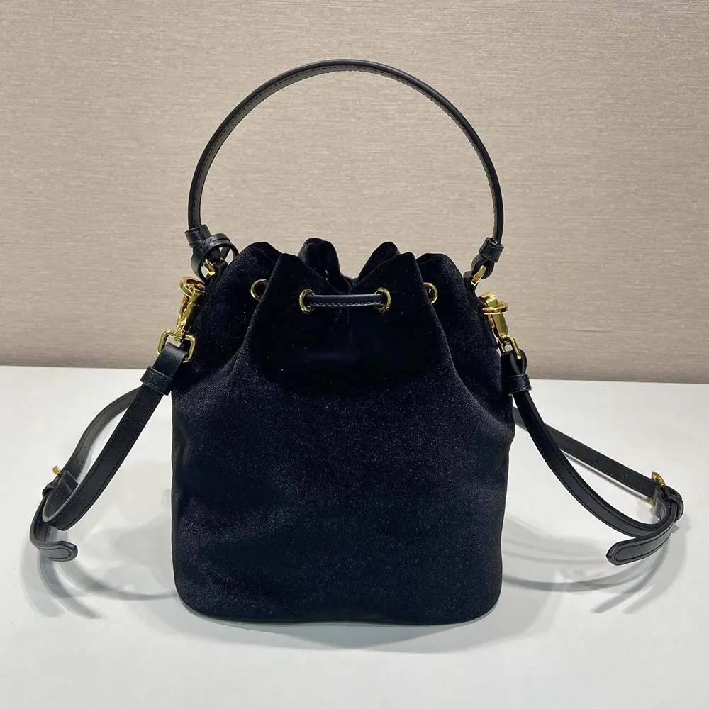Side angle showing compact silhouette of Prada Women Velvet Mini-bag