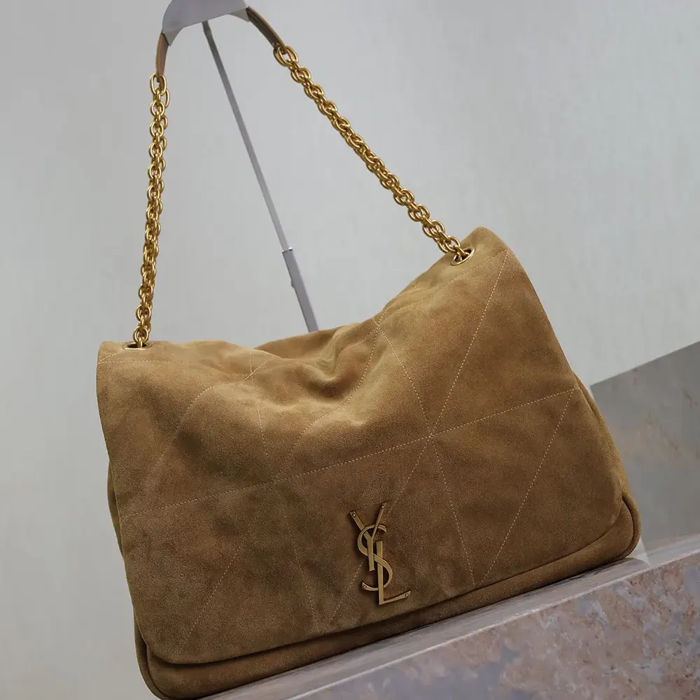 Close-up of gold YSL logo on Saint Laurent YSL Women Jamie 4.3 in Suede