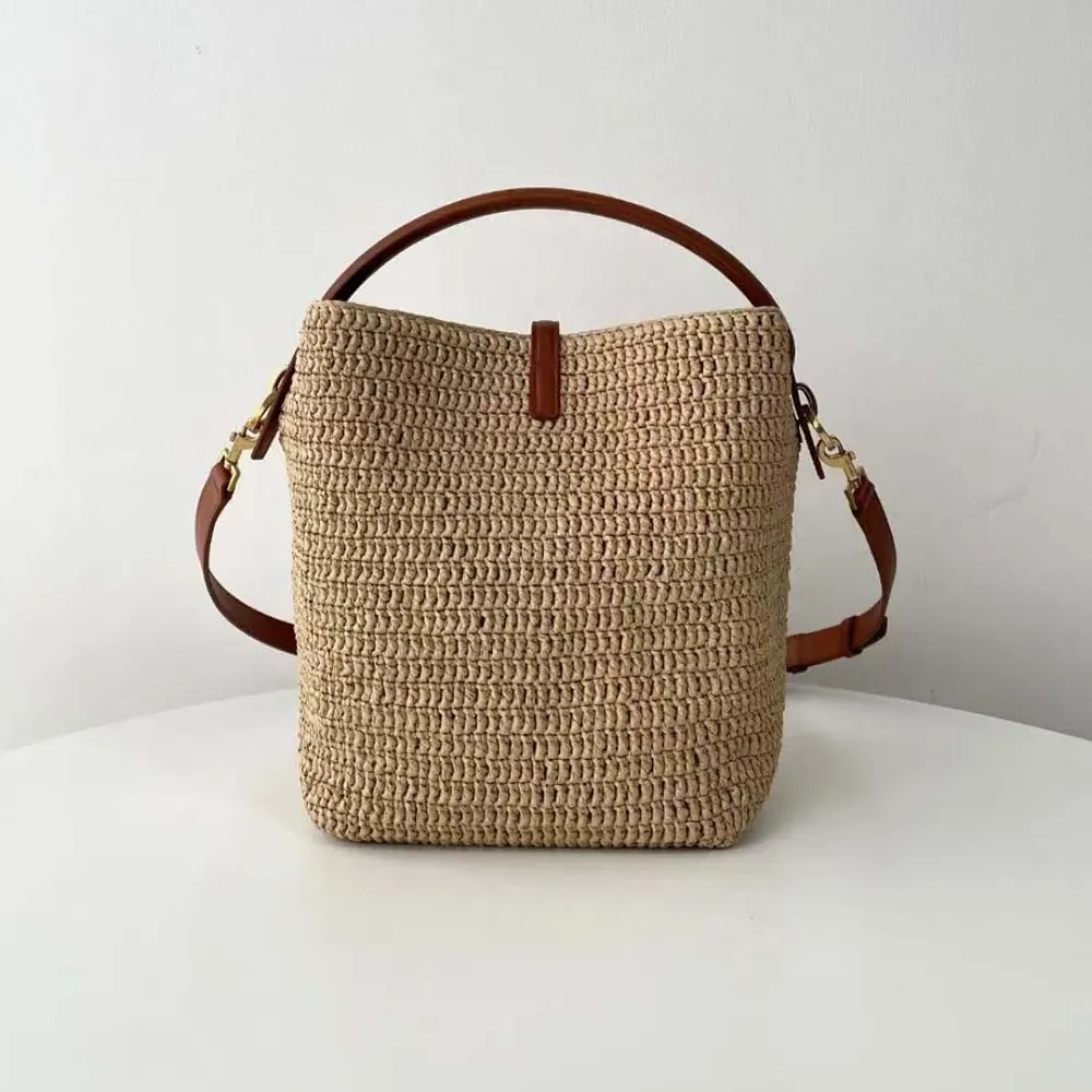 Side angle showing bucket silhouette of Saint Laurent YSL Raffia Bag