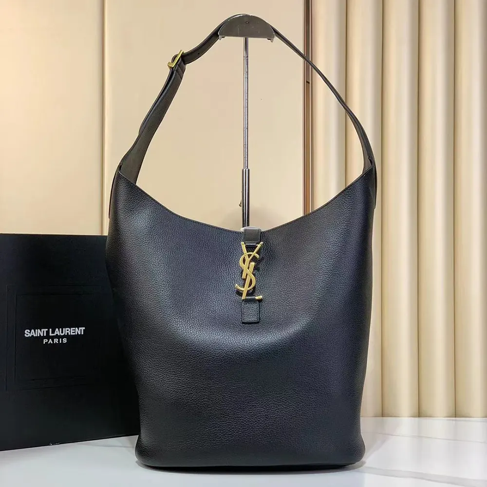 Close-up of gold-tone YSL logo detail on Le 5 à 7 Hobo bag