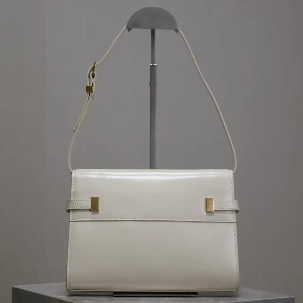 Side angle showing leather texture and shoulder strap of Saint Laurent bag