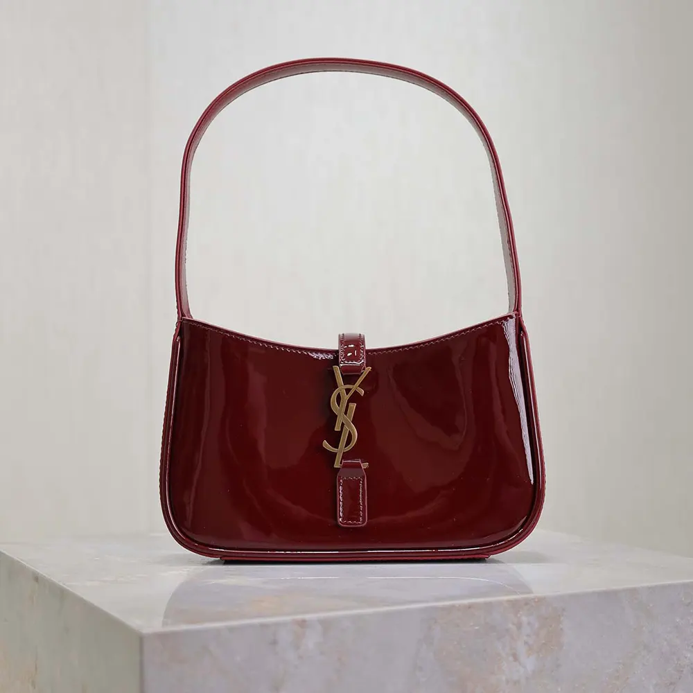 Close-up of gold YSL hardware on Saint Laurent YSL Women Mini Le 5 à 7 bag