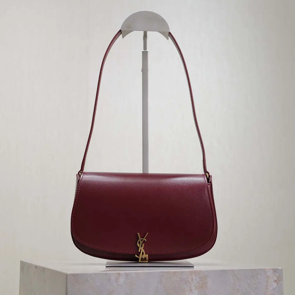 Close-up of gold YSL monogram on Saint Laurent YSL Women Mini Voltaire bag