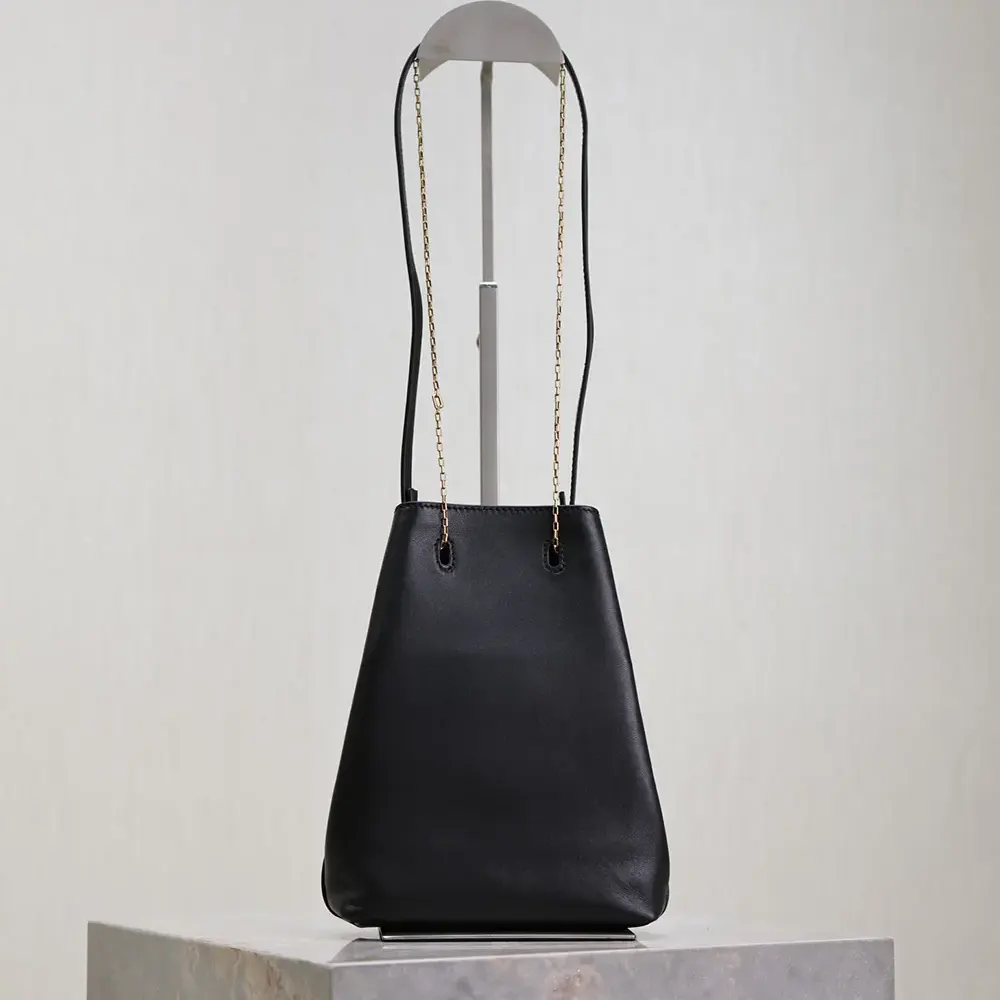 Side profile showing rounded silhouette of Saint Laurent YSL Women Pochon