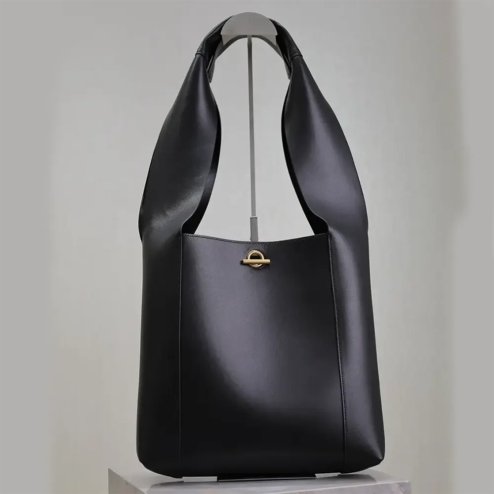 Side profile showing structured silhouette of Saint Laurent YSL Women Tanger in Leather