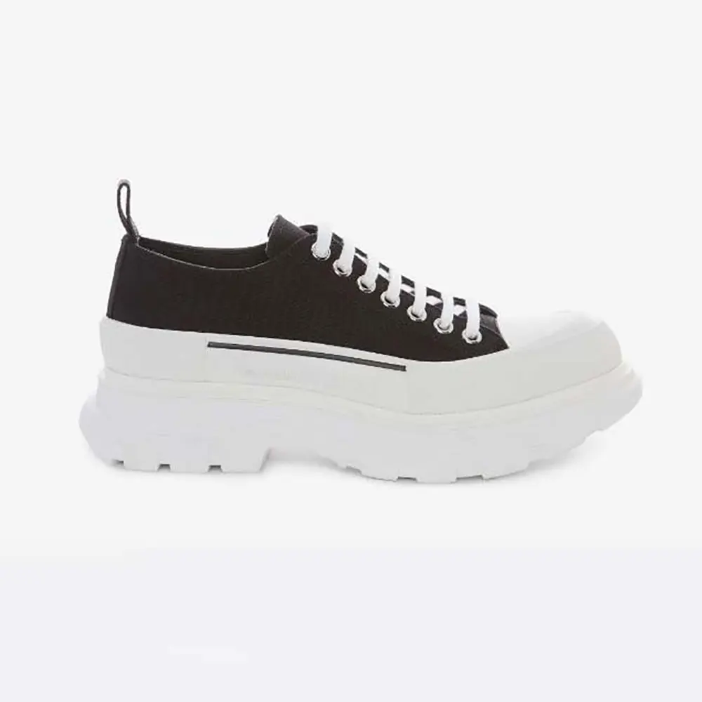 Side view of Alexander Mcqueen Unisex Tread Slick Lace Up black white sneakers