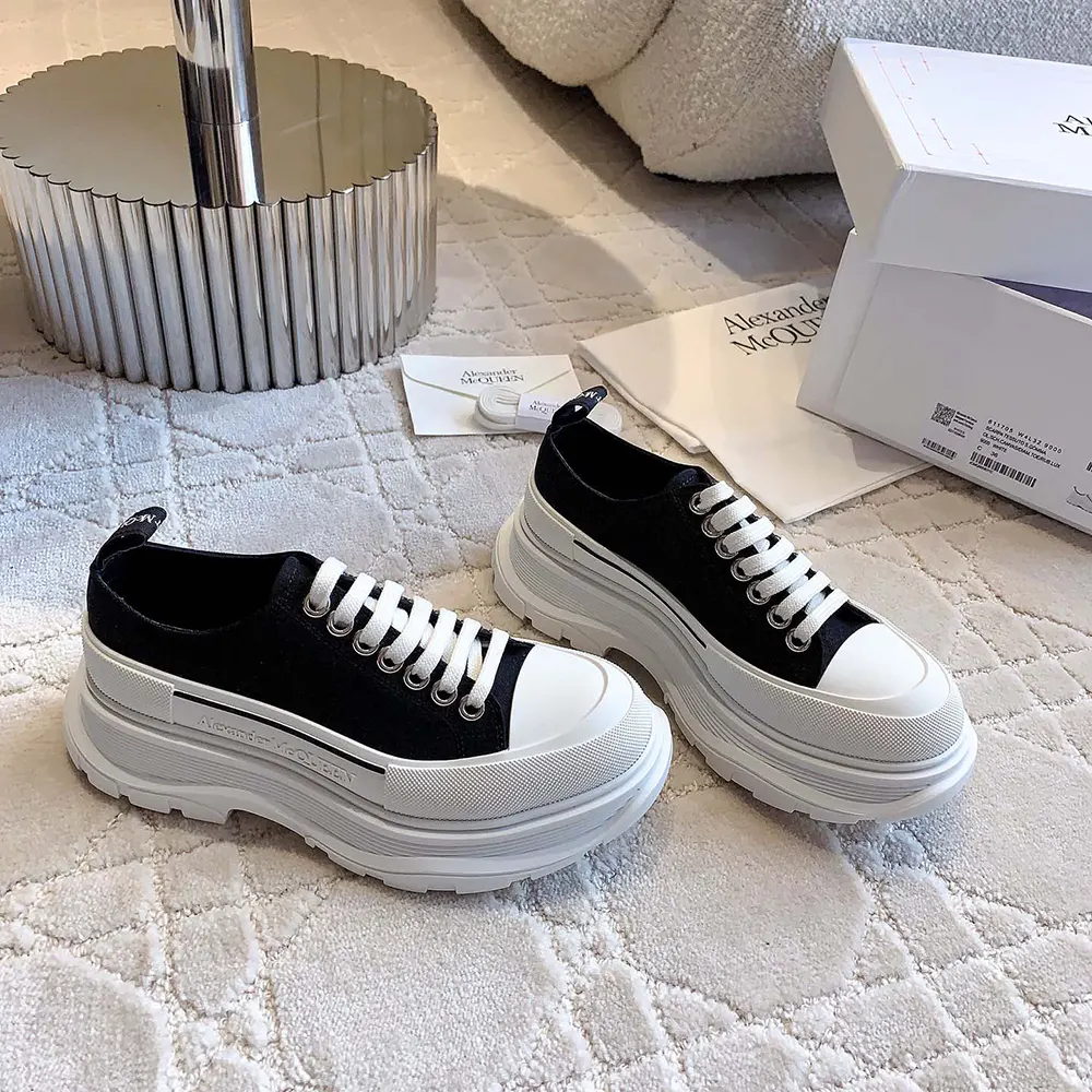 Close-up of lace-up and signature tread sole on Alexander Mcqueen sneakers