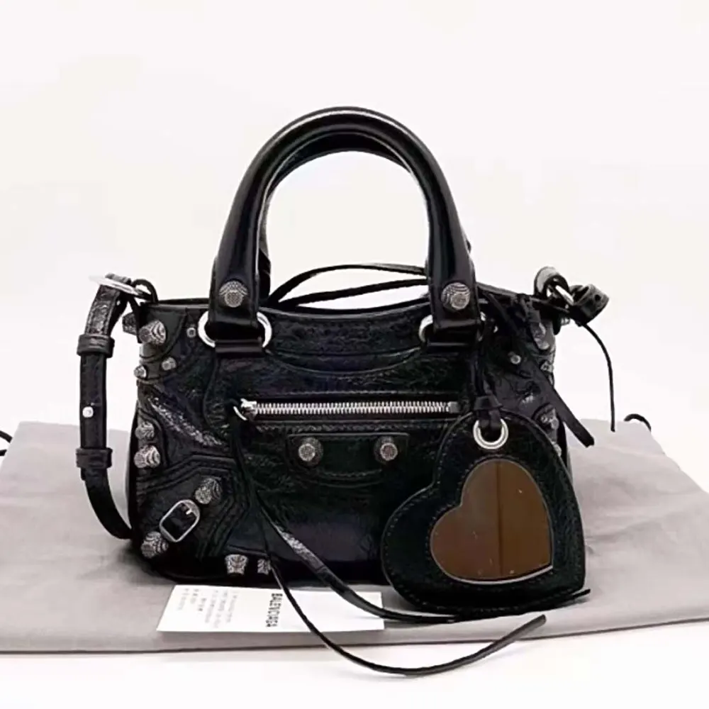 Close-up of silver-tone hardware on Balenciaga Women Neo Cagole XS Handbag