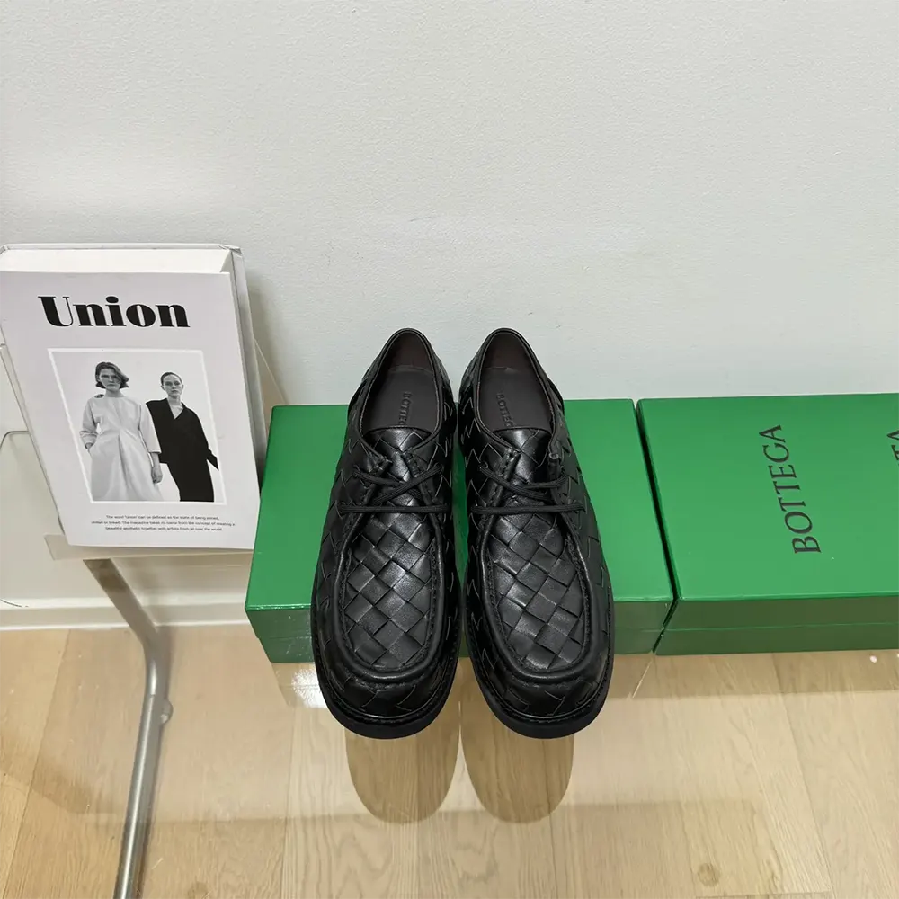 Close-up detail of black leather and laces on Bottega Veneta Haddock shoe