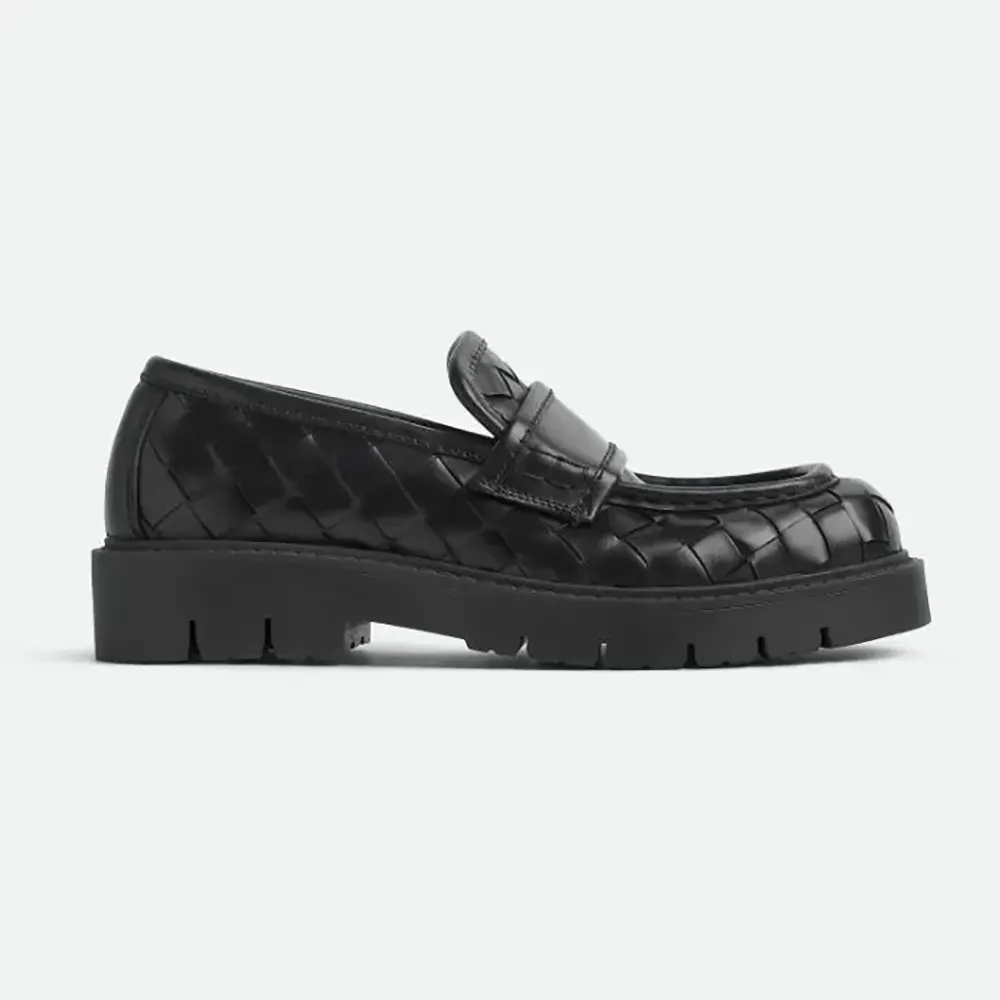 Side profile of Bottega Veneta Unisex Haddock Loafer-Black showing woven detail