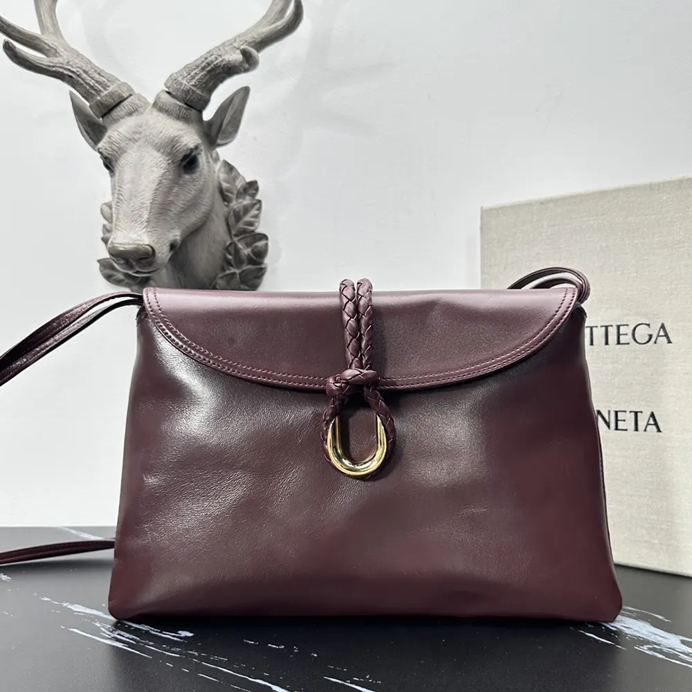 Close-up of signature intrecciato detail on Bottega Veneta Liberta Bag