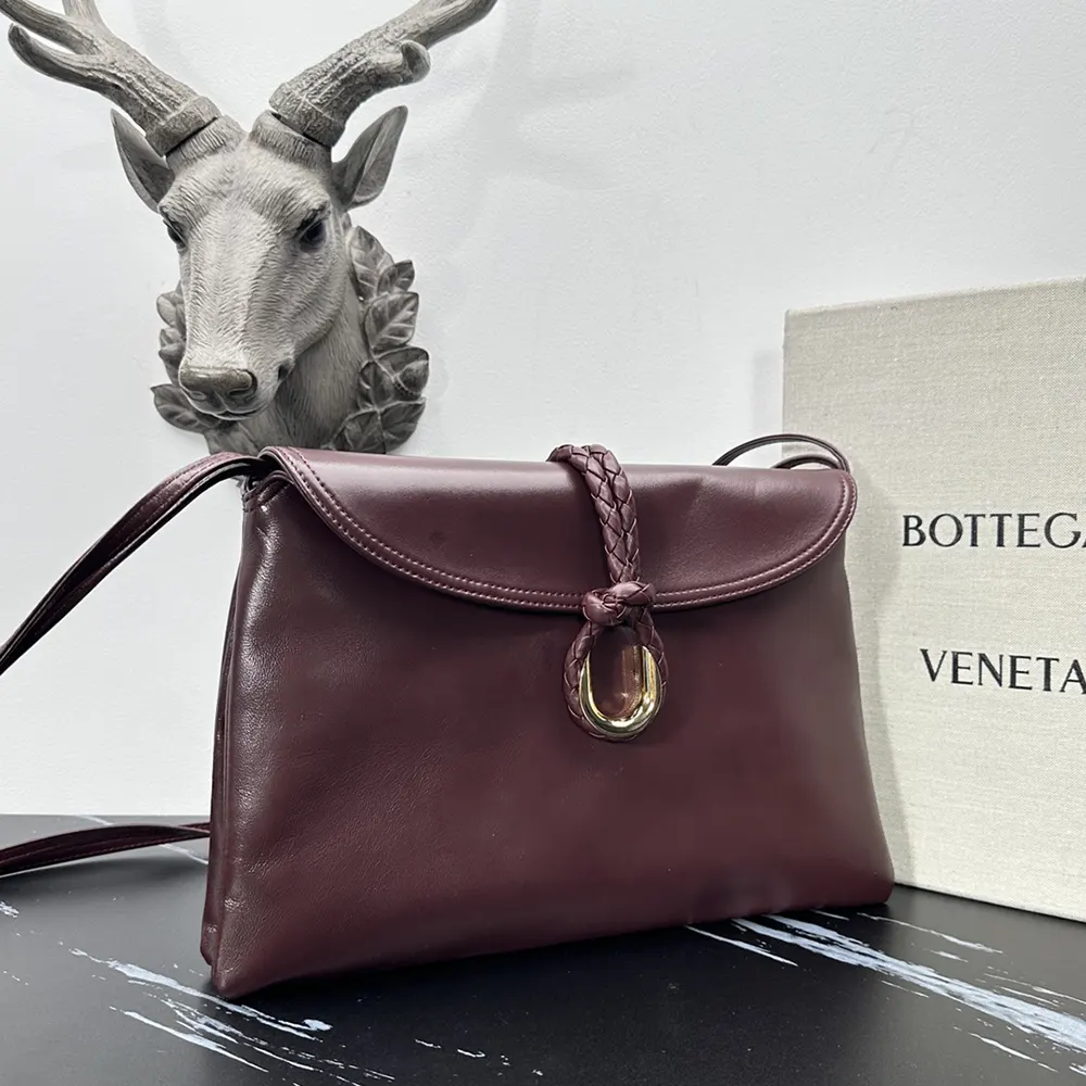Side angle showing smooth calf leather texture on Bottega Veneta Liberta Bag