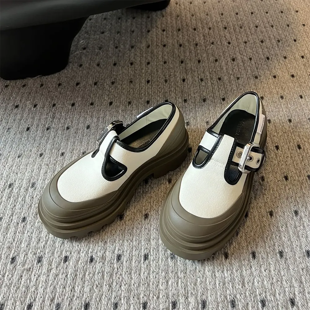Top angle showing chunky rubber sole and Mary-Jane strap on Bottega Veneta shoes
