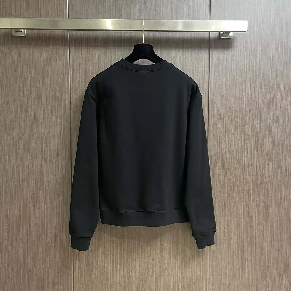 Side angle showing relaxed fit of Celine Men Blason Loose Sweatshirt black
