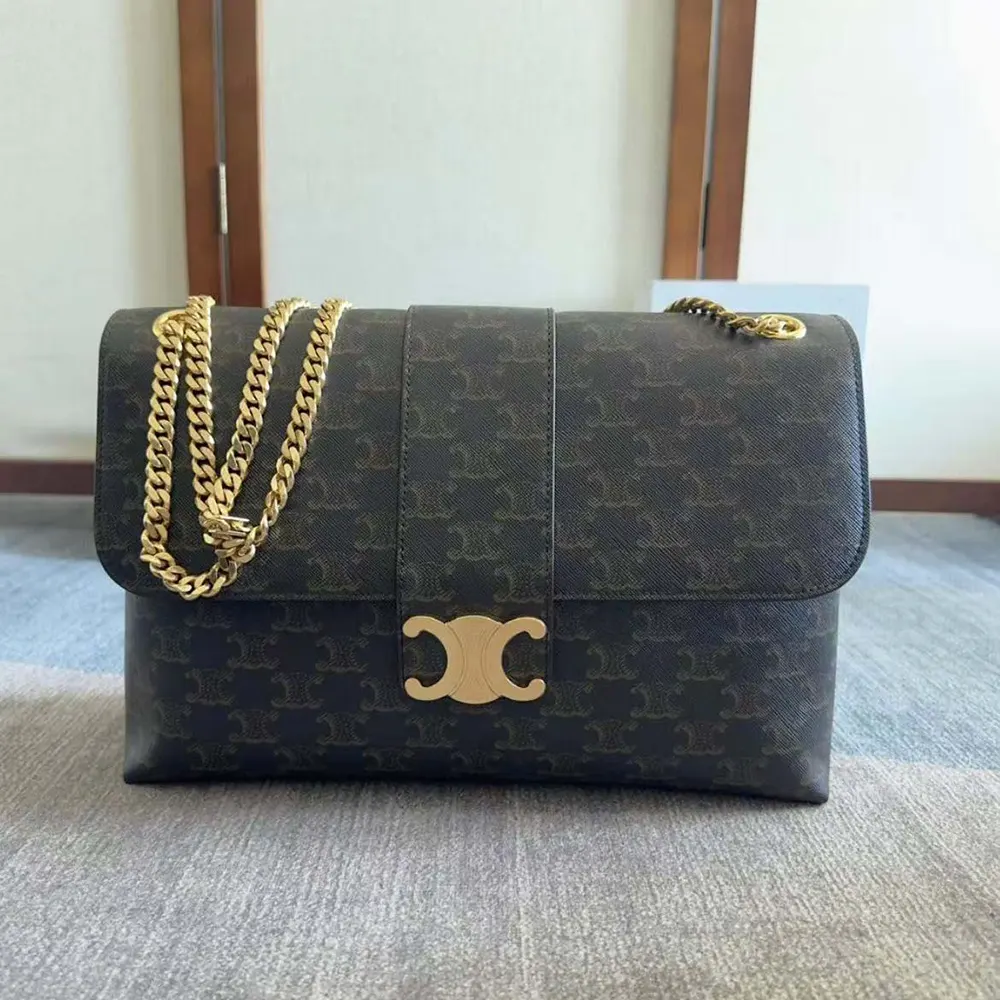 Close-up of gold-tone clasp on Celine Women Large Celine Victoire Bag