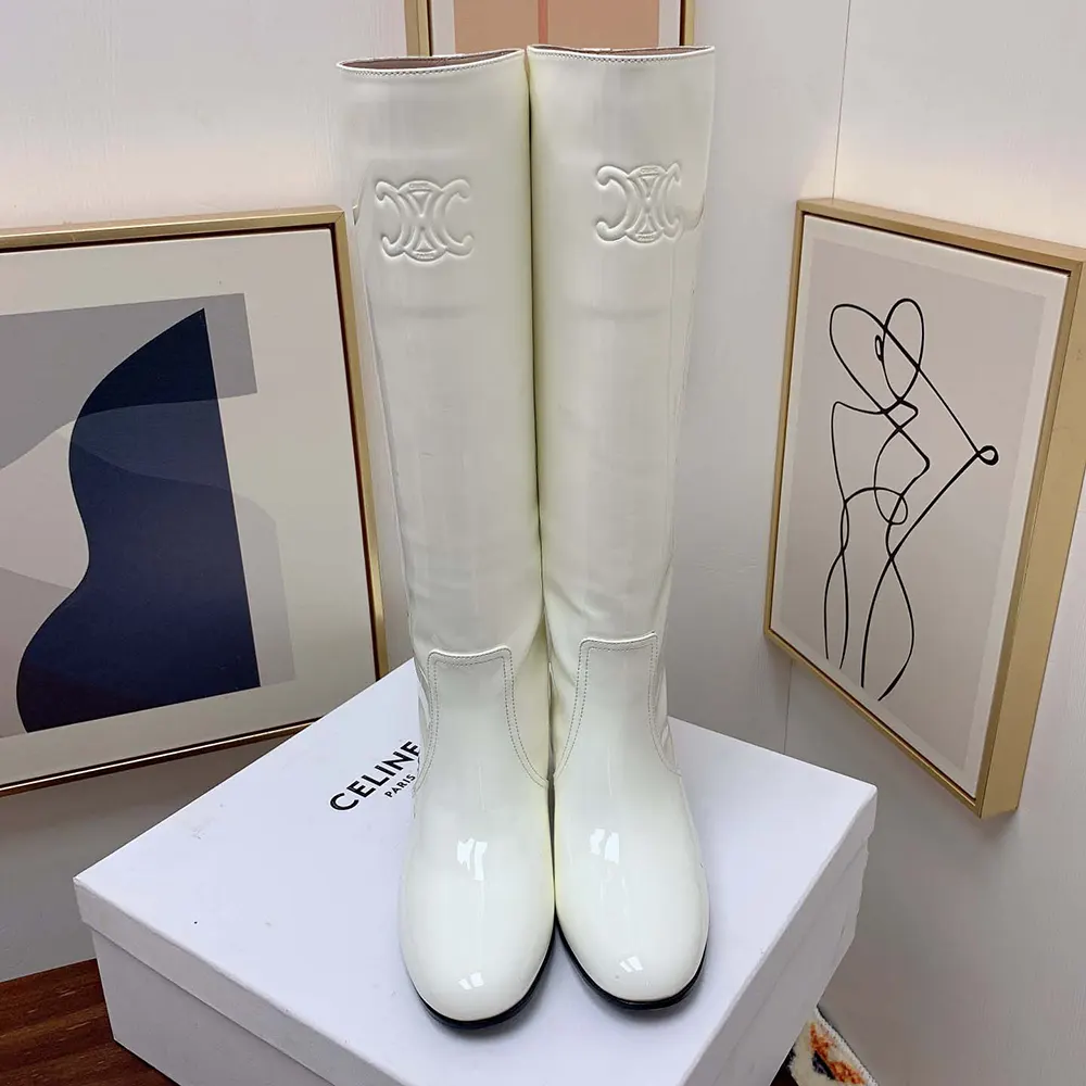 Detail view of glossy patent calfskin and side zipper on Celine Triomphe boot