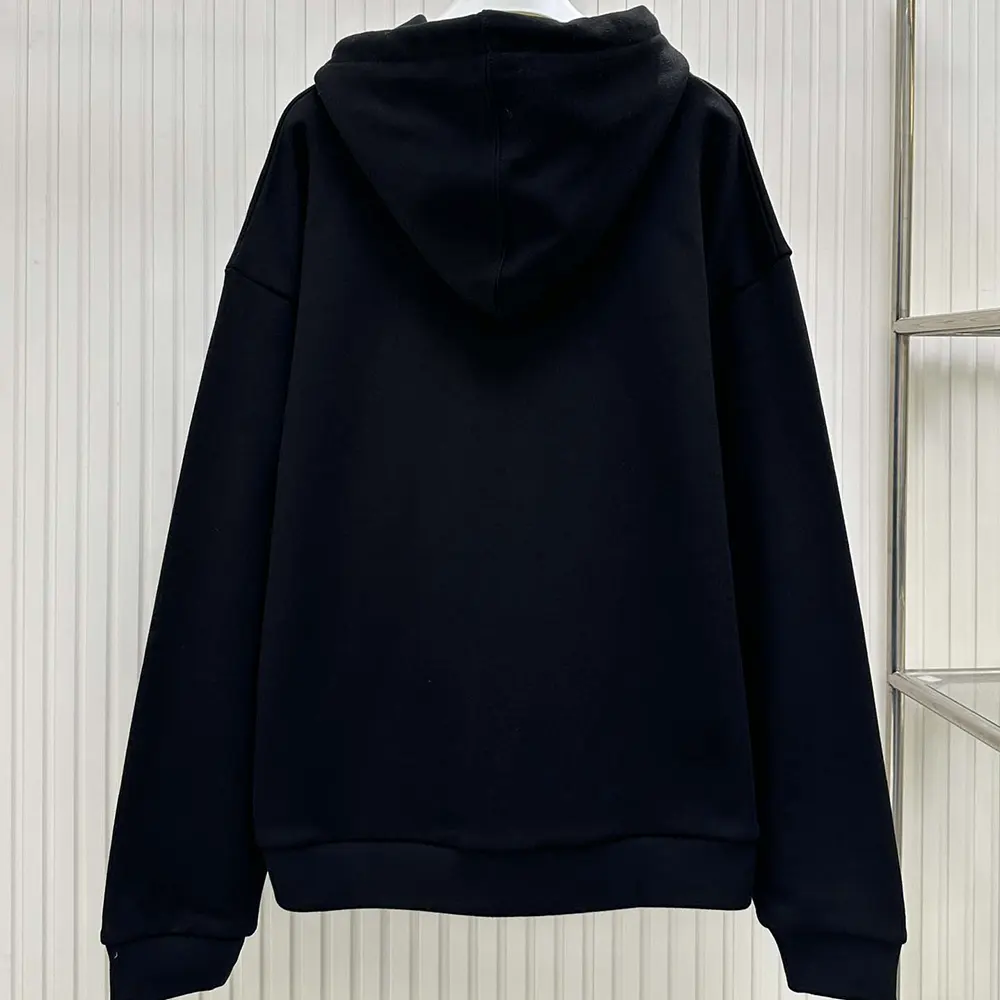 Side profile showing relaxed silhouette of Celine Women Troubadour Loose Hoodie