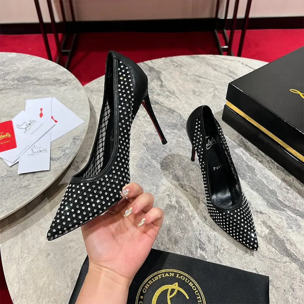 Back angle showing iconic red sole and spike detail on Christian Louboutin pumps