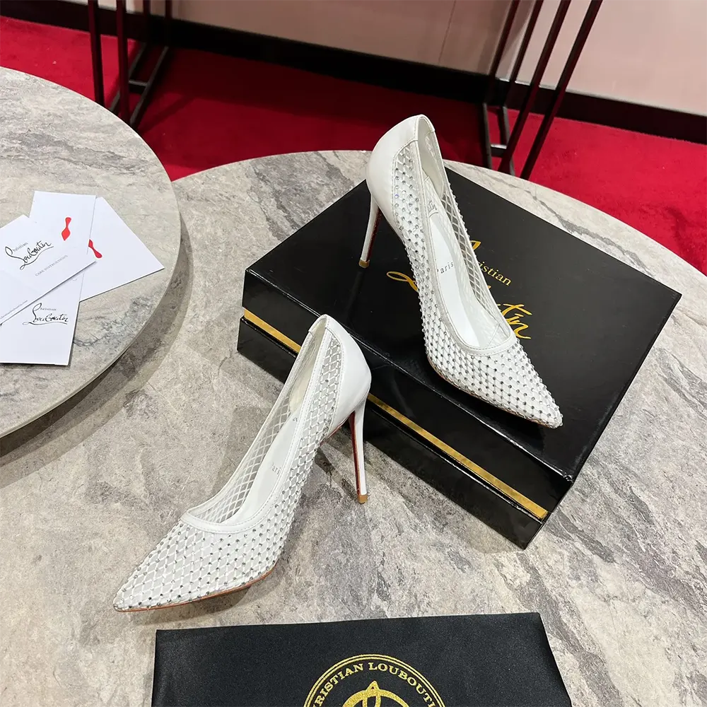 View of iconic red sole on Christian Louboutin Women Apostropha pumps
