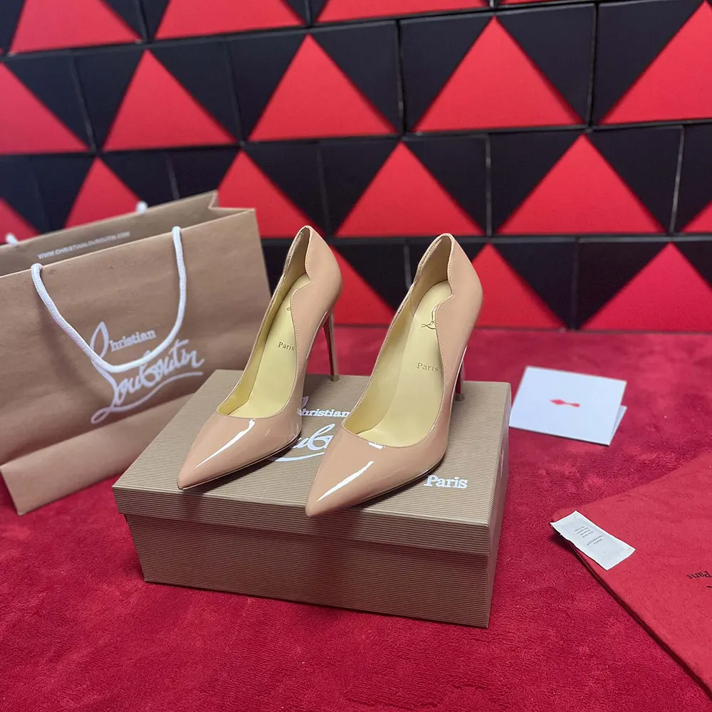 Top view highlighting pointed toe of Christian Louboutin Hot Chick beige patent pumps