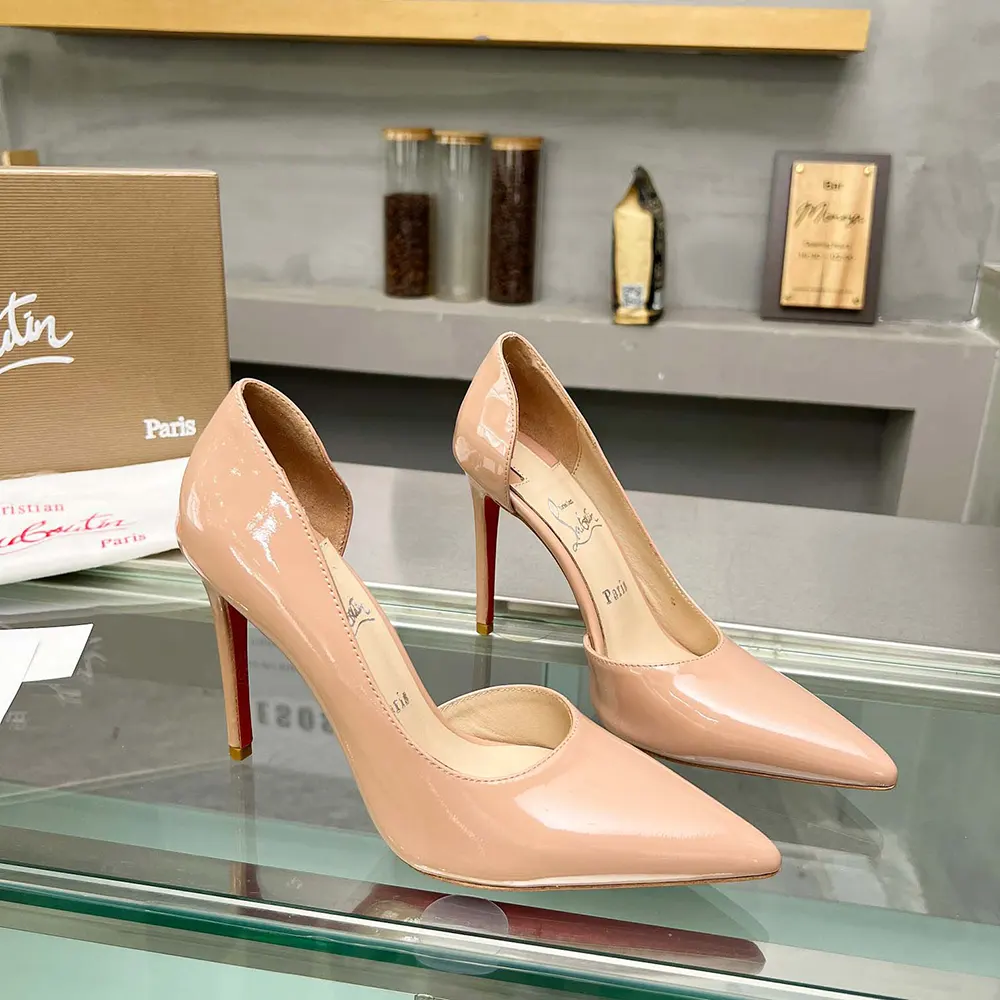 Close-up of glossy patent calfskin on Christian Louboutin Iriza pumps
