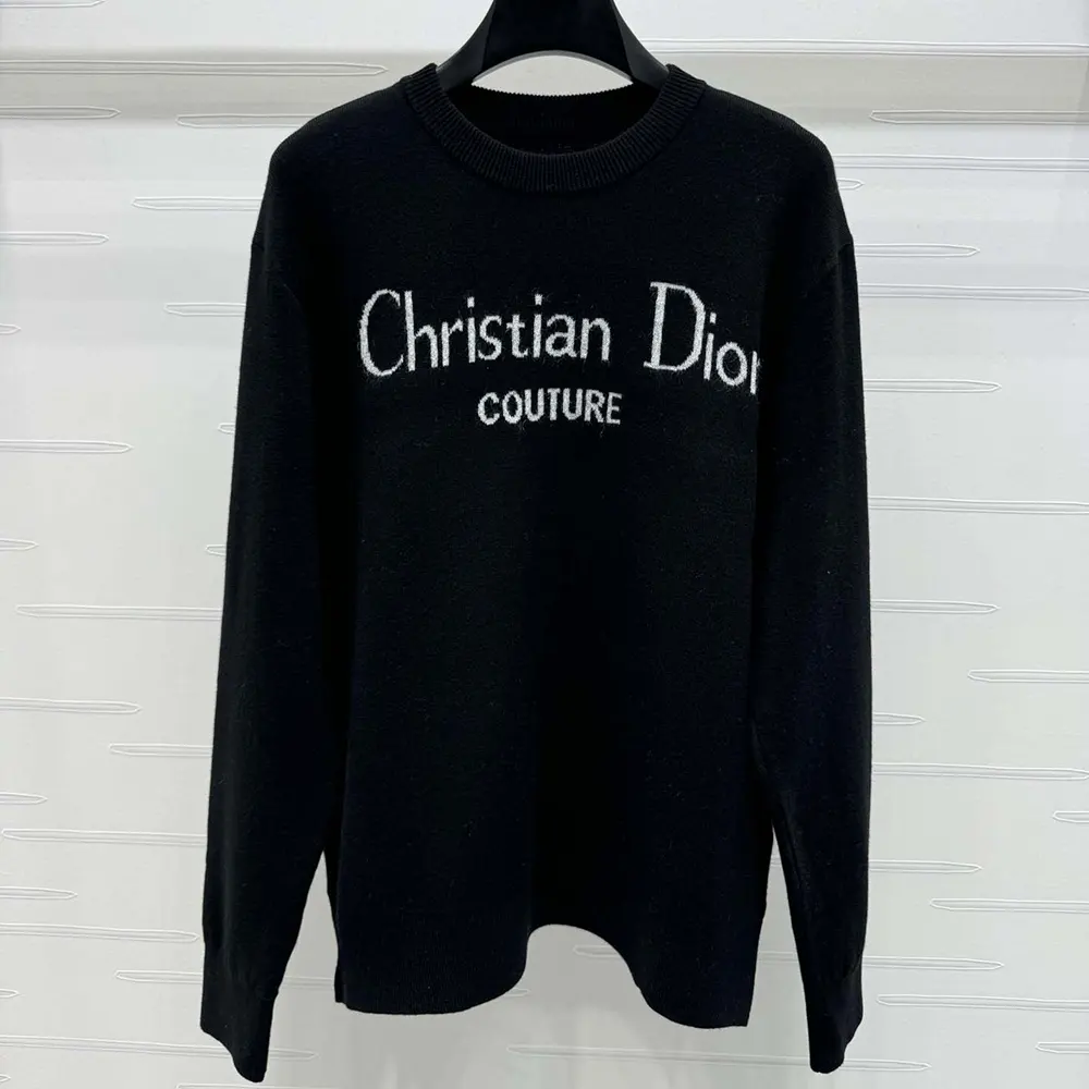 Close-up of embroidered Dior logo on black wool blend sweater