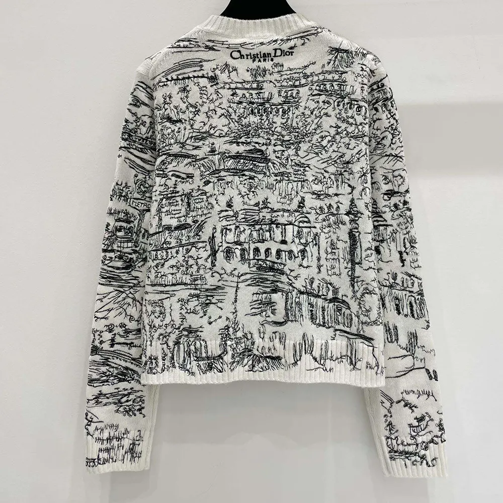 Side angle showing relaxed fit and ribbed cuffs of Dior Women Embroidered Sweater