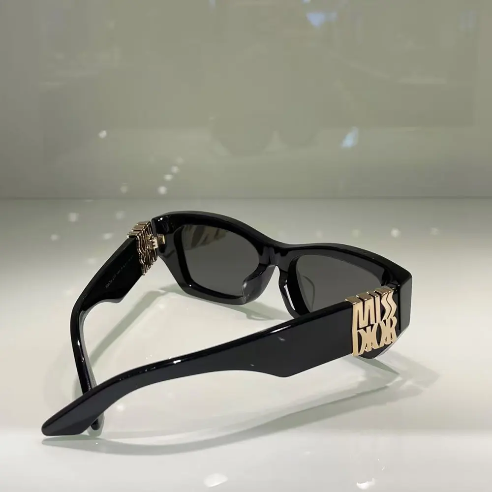 Side angle showing sleek black acetate frame of Dior Unisex MissDior S1I Sunglasses