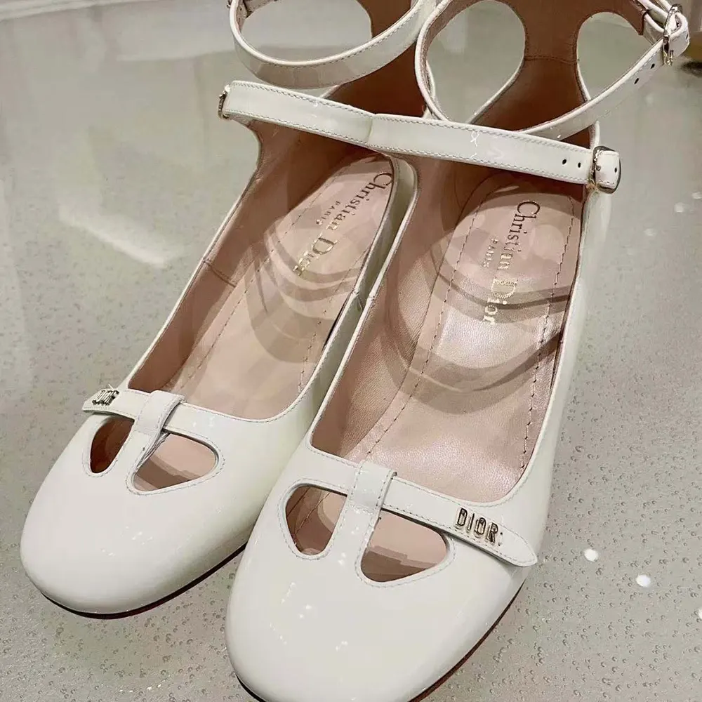 Rear view showing Dior signature detail on white patent calfskin pump