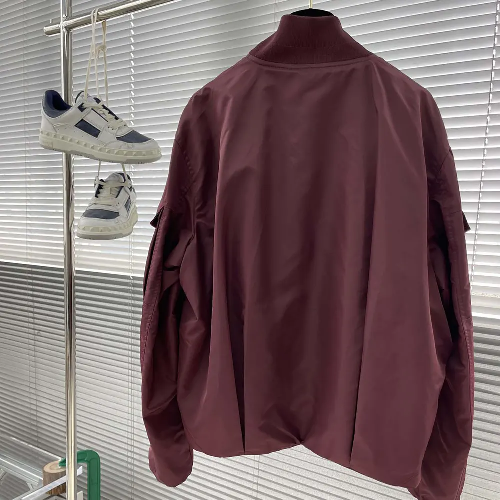 Side angle highlighting silhouette of Dior Women Christian Dior Couture Bomber Jacket