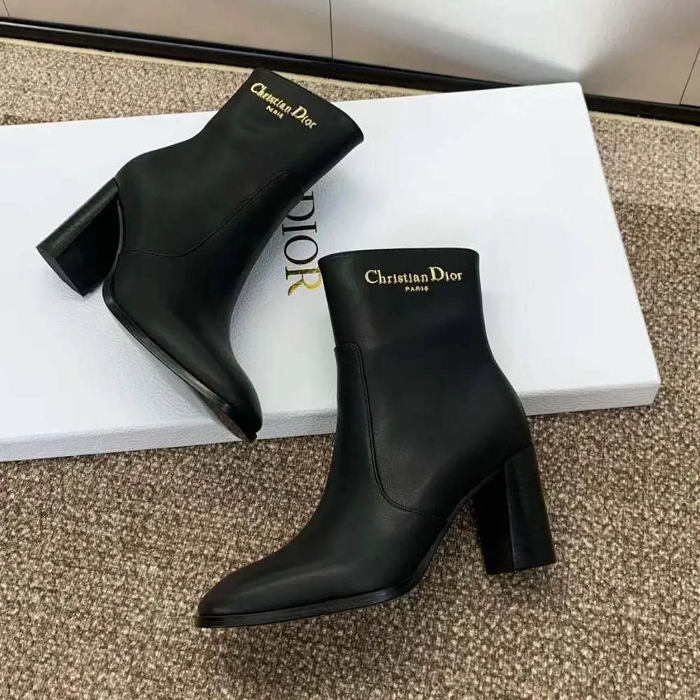 Close-up of Dior hardware on D-Town Heeled Ankle Boot in black